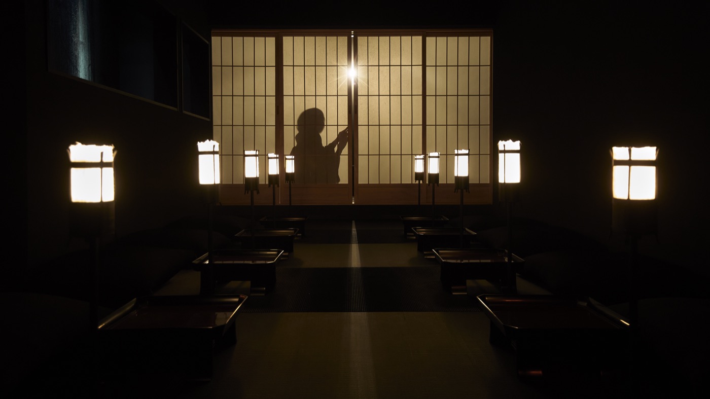 Private tatami room lit by lanterns